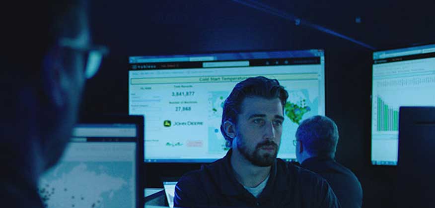Personnel view data on large screens and computer monitors