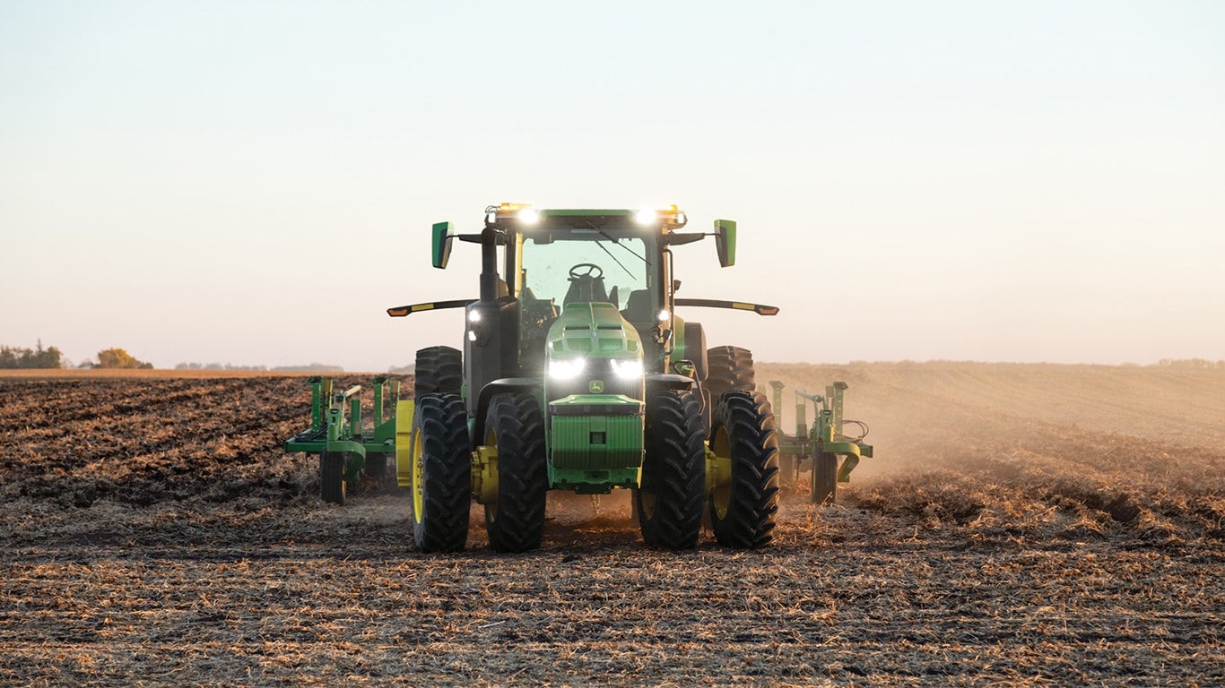 Photograph of autonomous John Deere 8R Tractor in a paddock