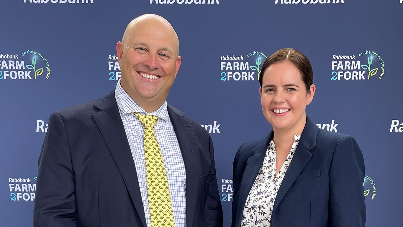 Managing Director, Luke Chandler, and Director of Aftermarket and Customer Support, Emma Ford, pose together in front of a farm2fork banner
