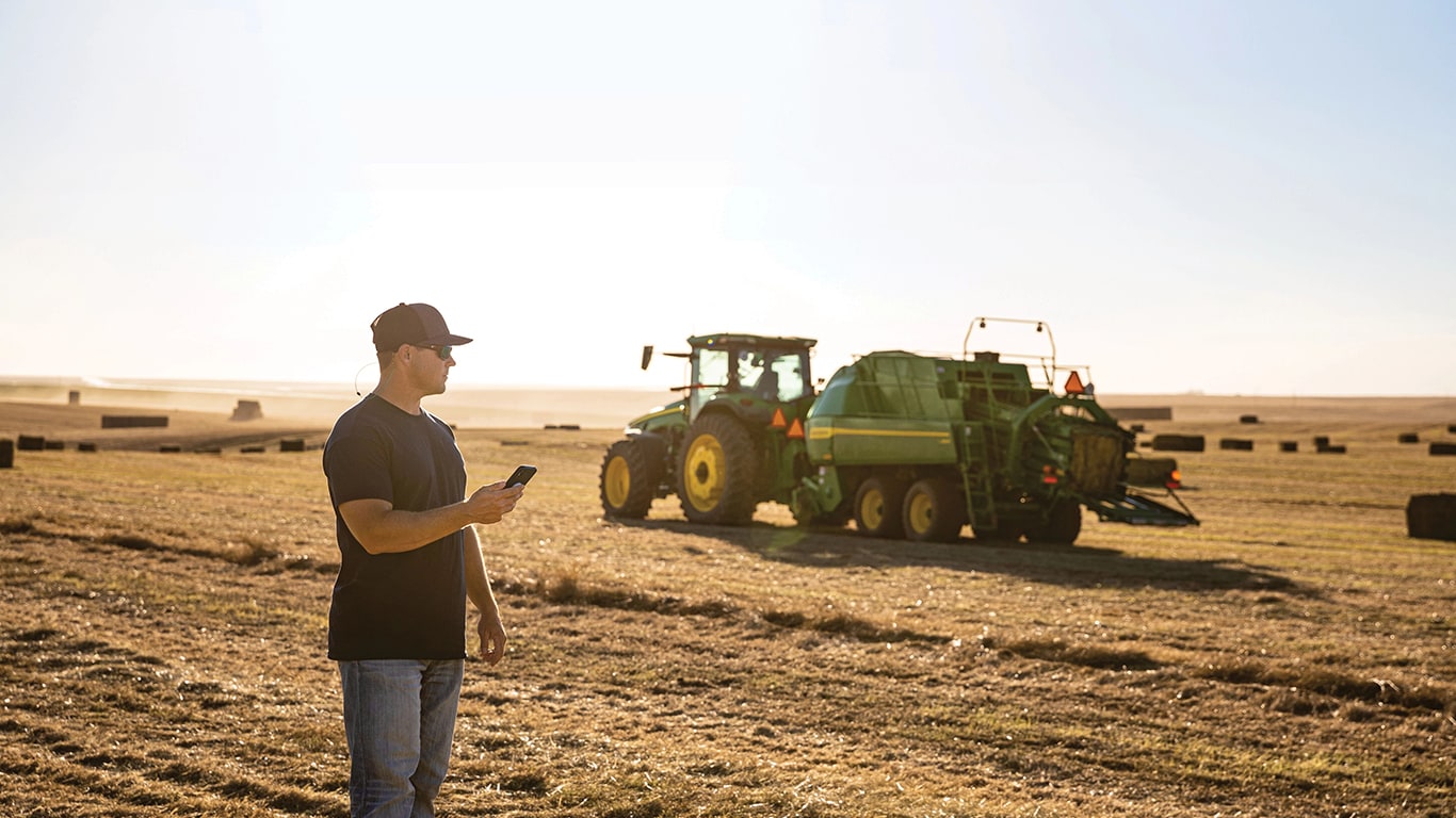 A large Square Baler operating in a field.