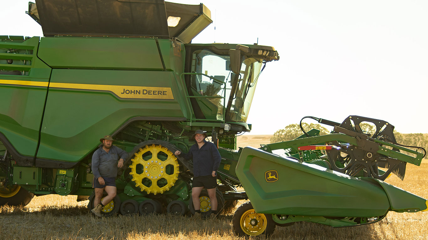 Daniel and Jack Winter in a paddock with their X9 Combine.