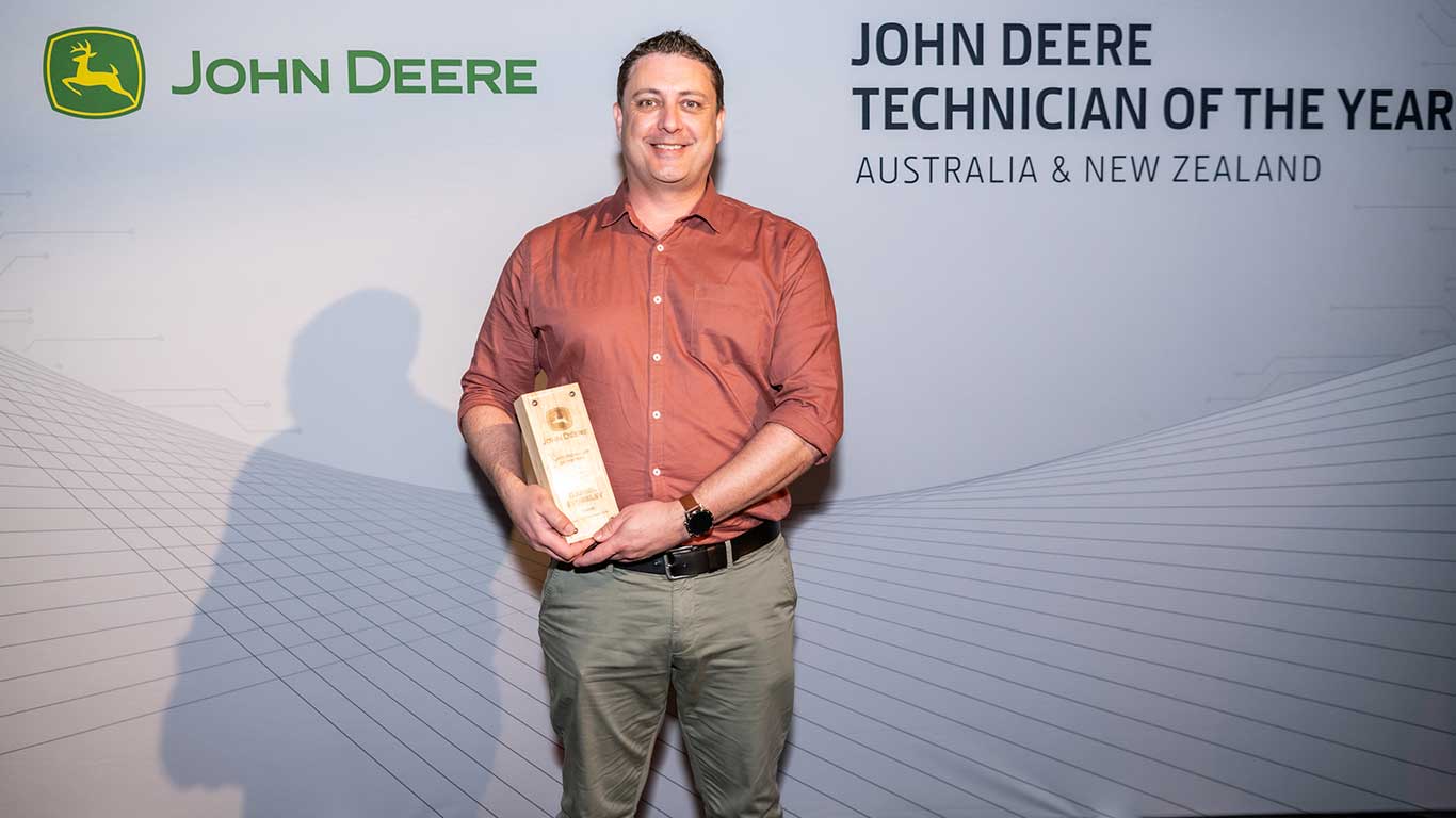 Daniel Stoneley displaying his award
