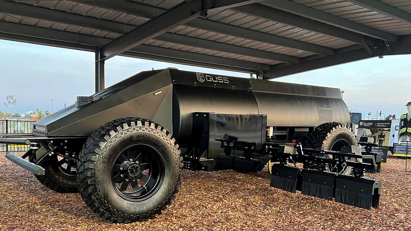 A person standing next to a tractor