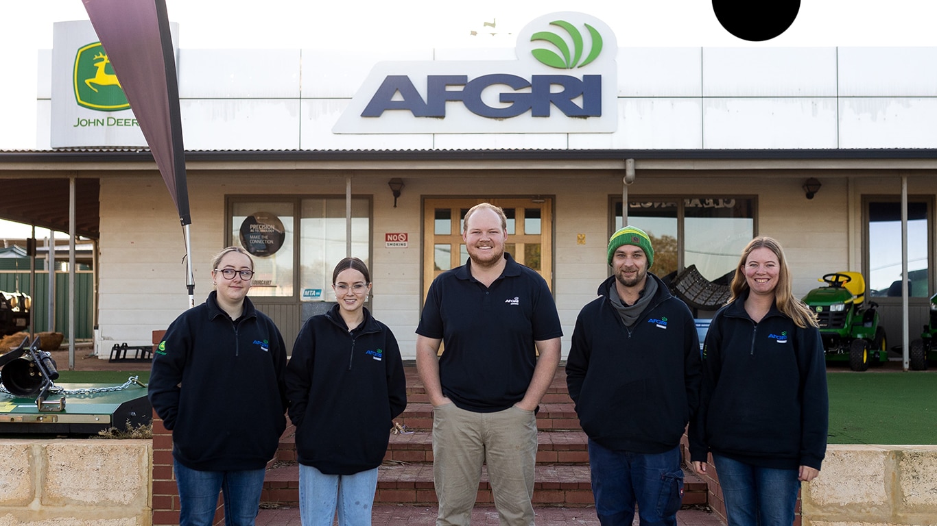 Caleb Dover stands in the centre and is flanked by his team of four at the AFGRI Equipment dealership in Western Australia
