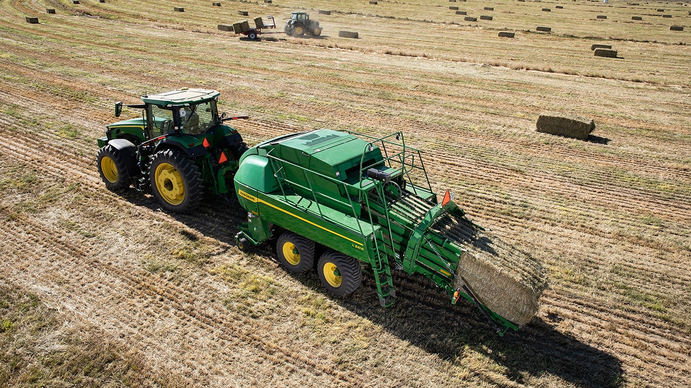 High Density Large Square Baler, 6Series Tractors operating in a field