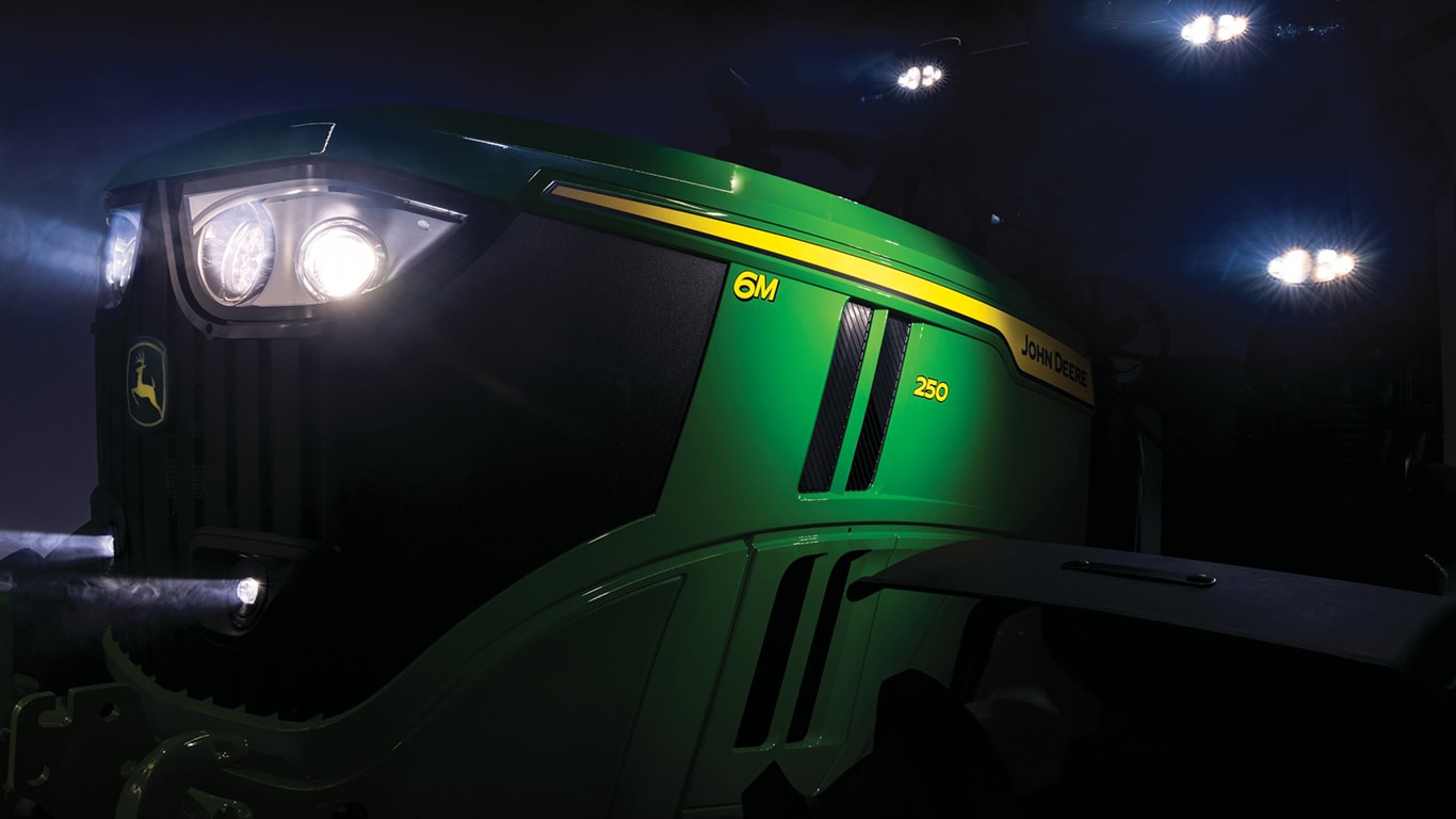 a 6M 250 in the dark with a spotlight showing on the tractor model number