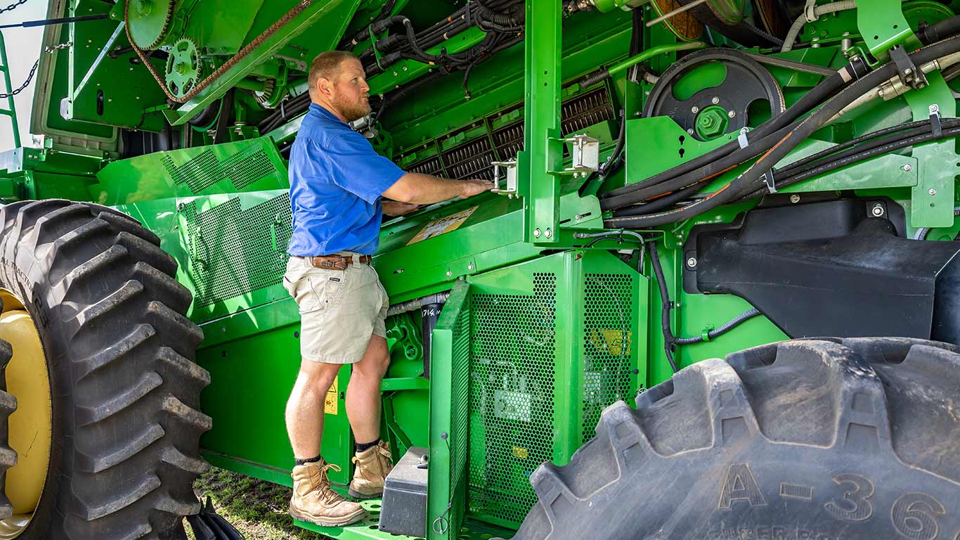 Xander checking underneath S770 combine