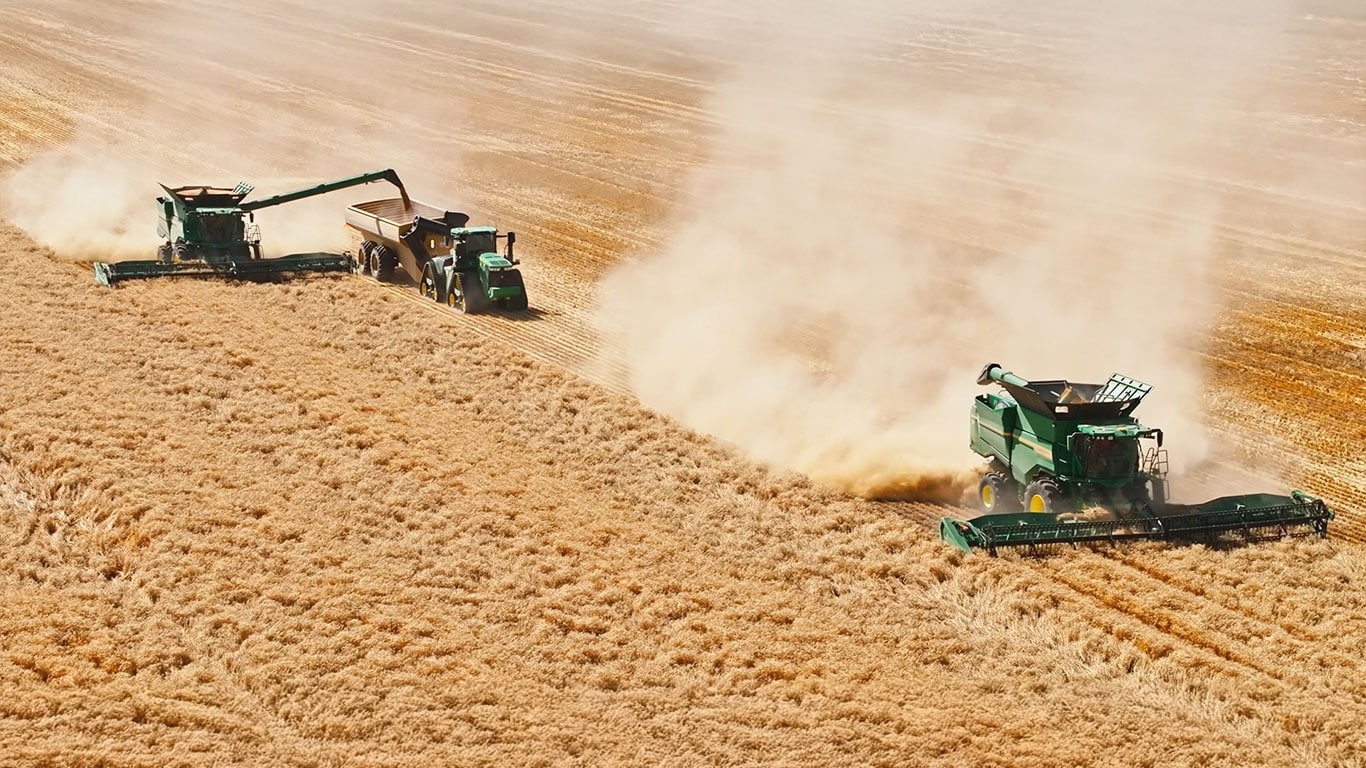 S7 combines harvesting in paddock.