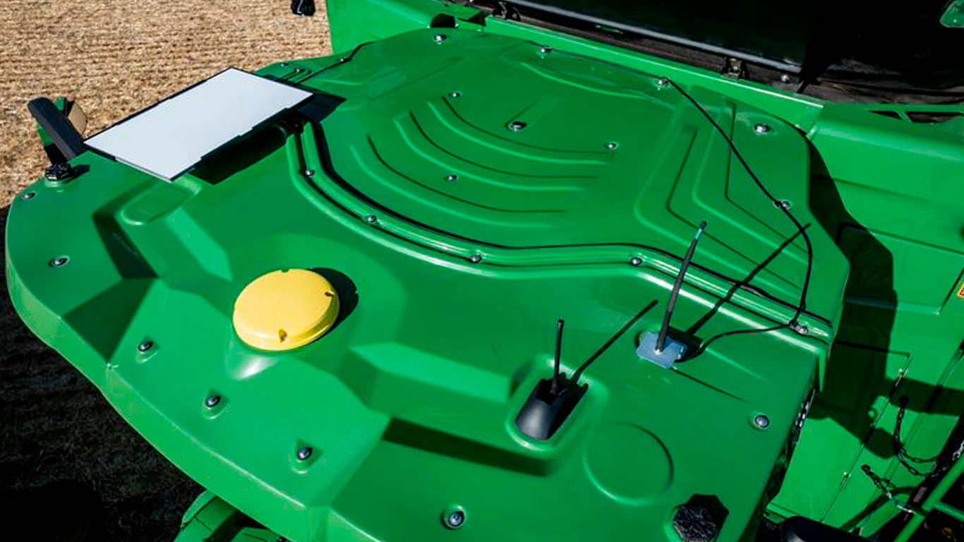 Green piece of technology on machine in paddock