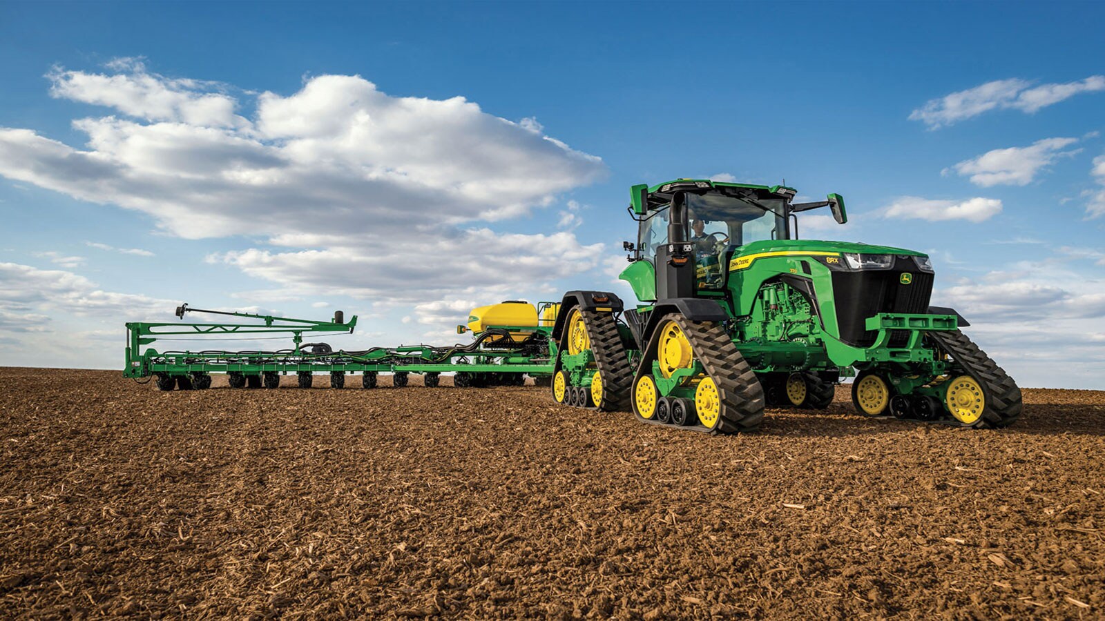 8RX 370 shown in harvested corn field.