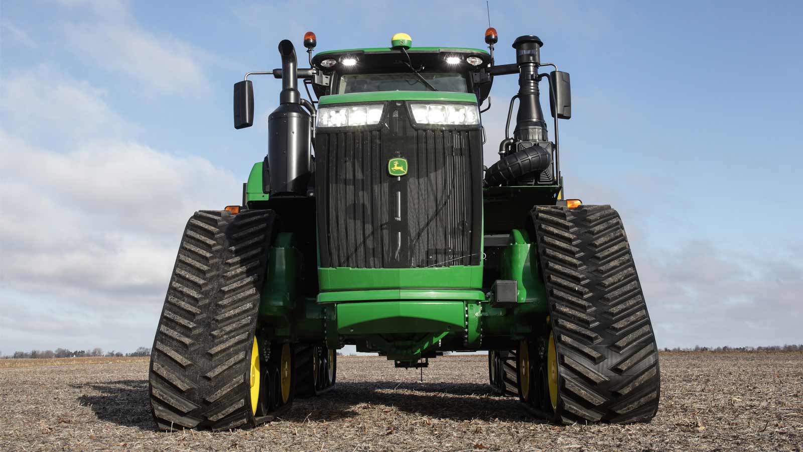 Front view of a 9R Series tractor in a field