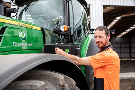 Andy Hey leans on his tractor