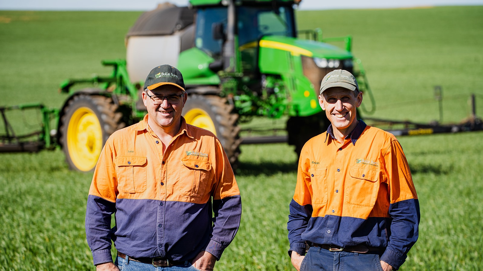 Robin Schaefer and John Gladigau standing in field