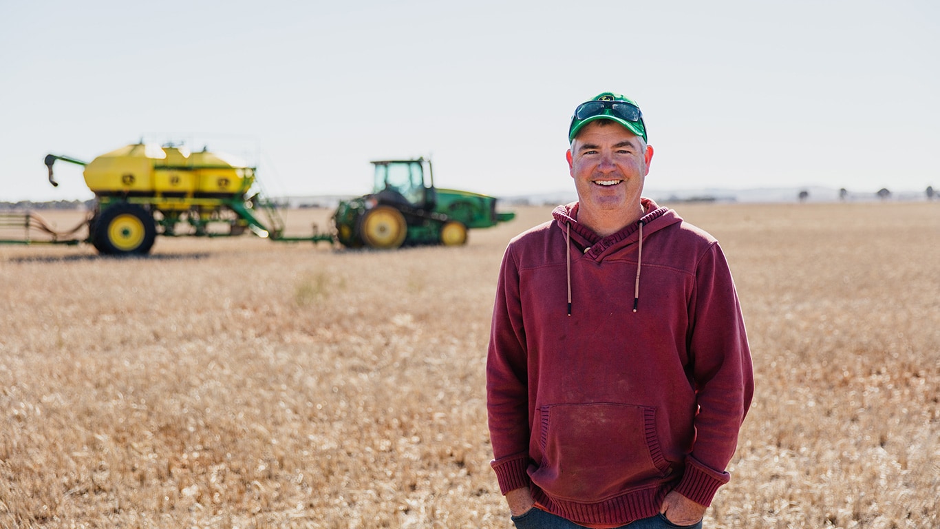 Scott Clark standing in a field.