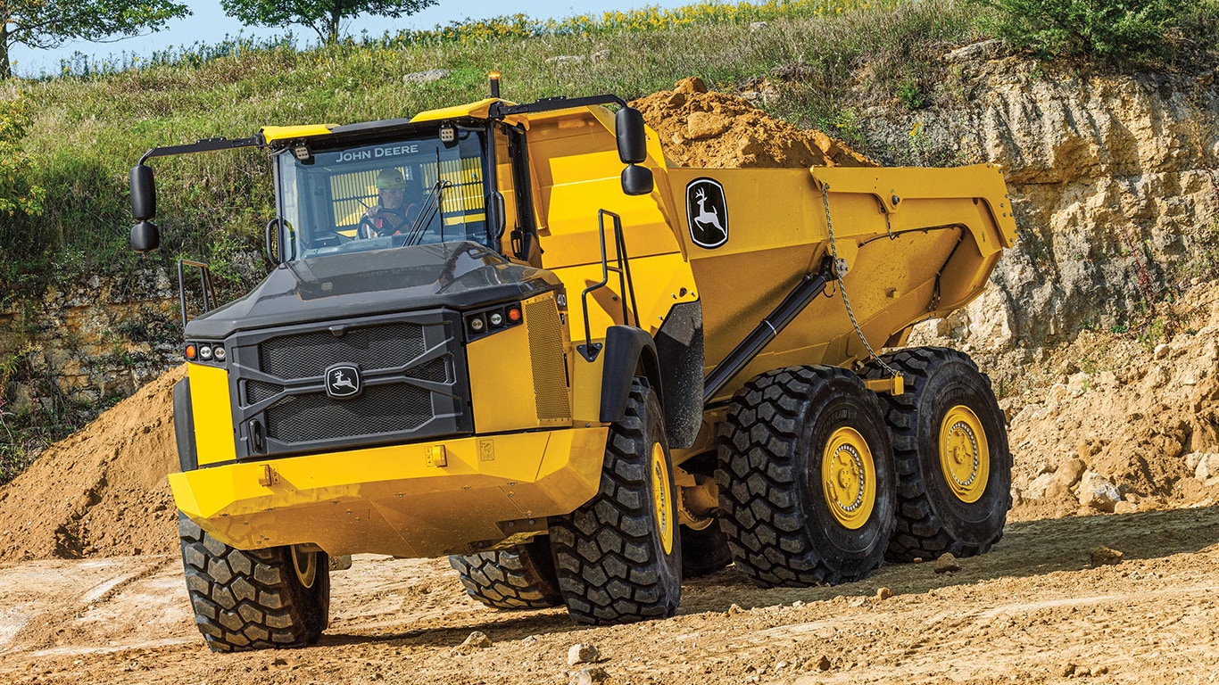 A 460P Articulated Dump Truck with dirt in the bed at a worksite.