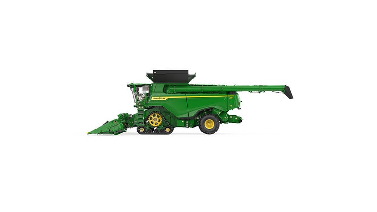 Right side-view of x9 1000 combine on a white background
