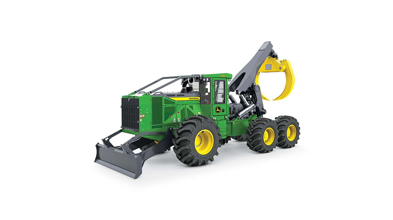 Green and yellow forestry machine with large tires and front blade for logging tasks.