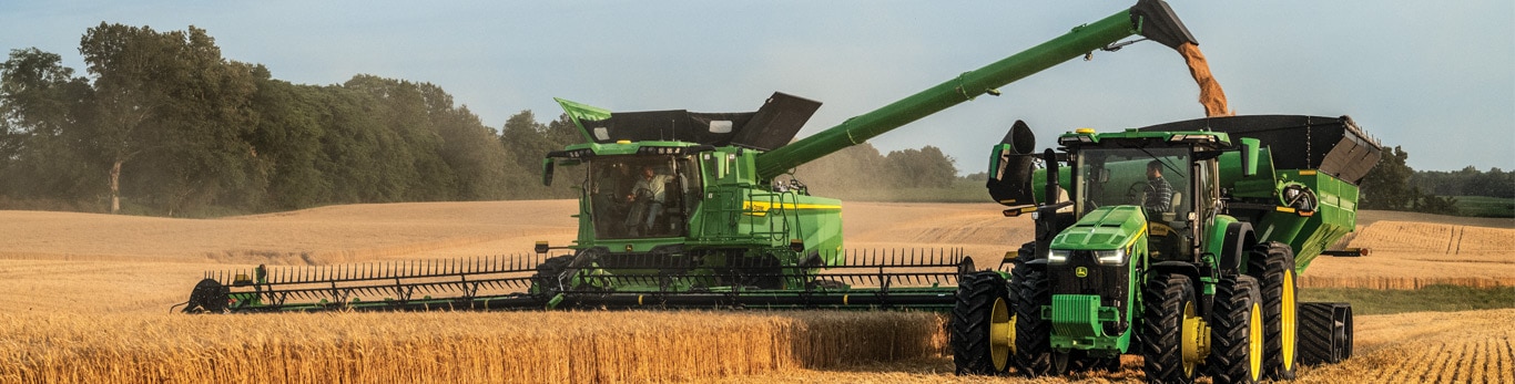 Combine Harvester running in the field with superimposed data streams
