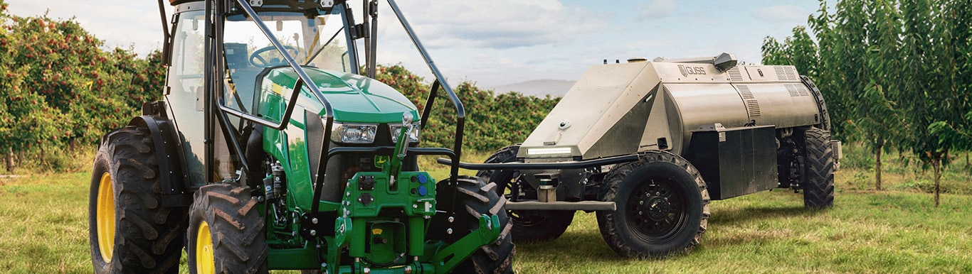 John Deere specialty tractor in a field with attachment