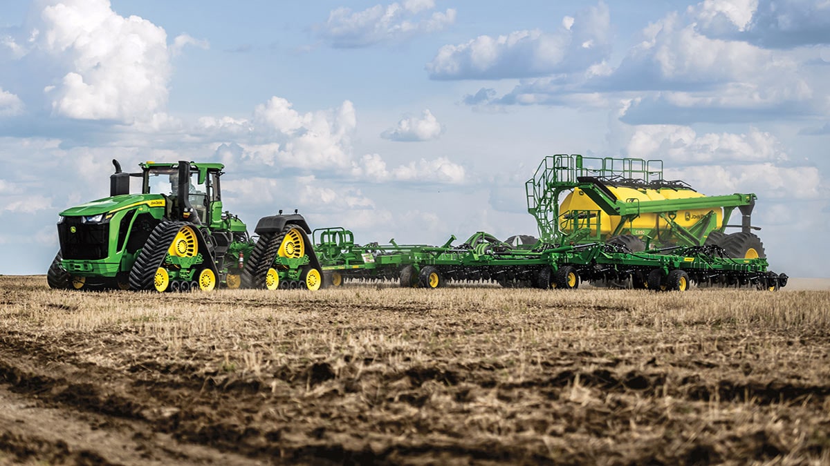 9RX 830 High HP Tractor pulling air seeder in field