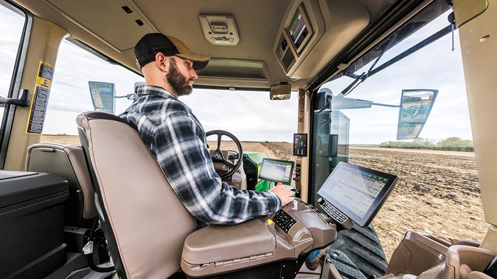 Operator looking to right in cab of 9RX 830