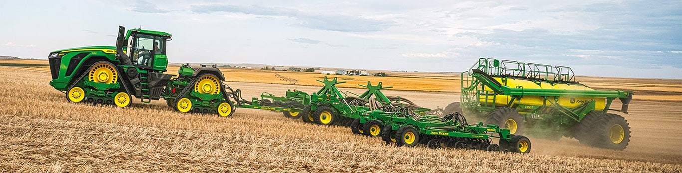 9RX 830 pulling air drill and air cart in field