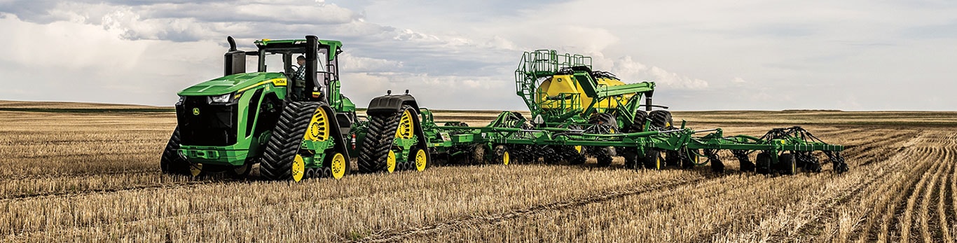 9RX 830 pulling air drill and air cart in field