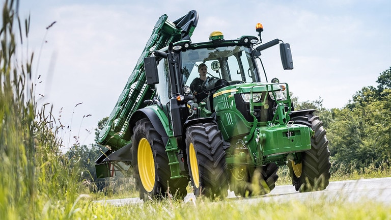 Tractor with rear-mounted vertical-fold R310R attached and folded