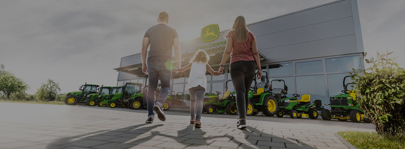 Family walking to dealership