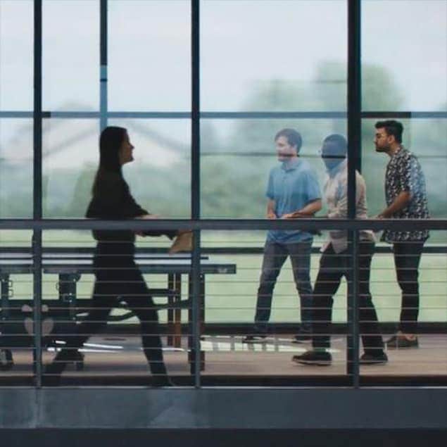 John Deere employees standing at ISG facility