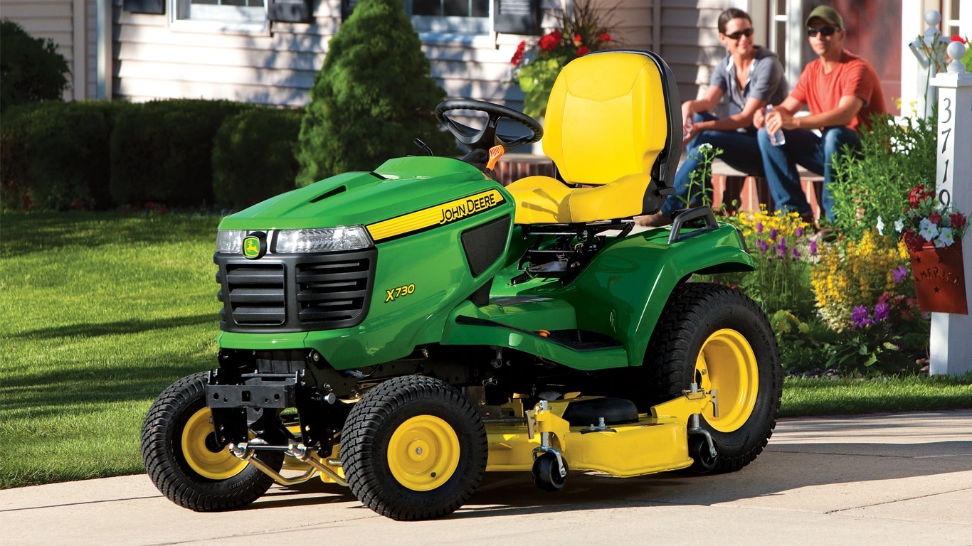 ride-on mower sitting on front lawn