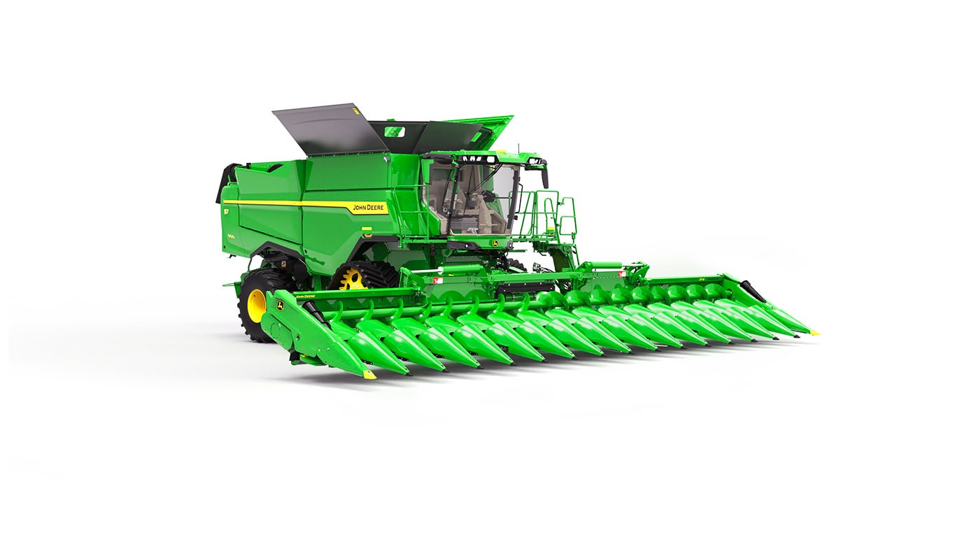 Photo of a John Deere S7 900 combine with a draper head on a white background