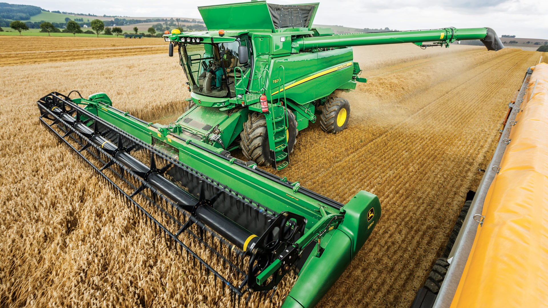 T Series Combine Moving through crops
