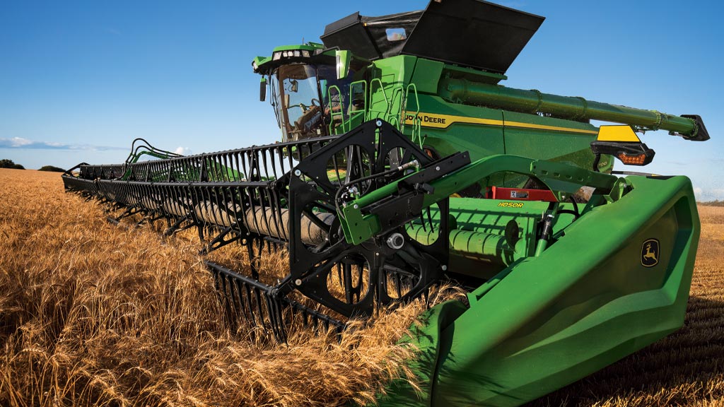 Draper on combine in a wheat field