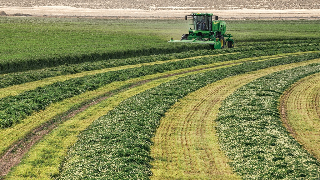 Windrower in field