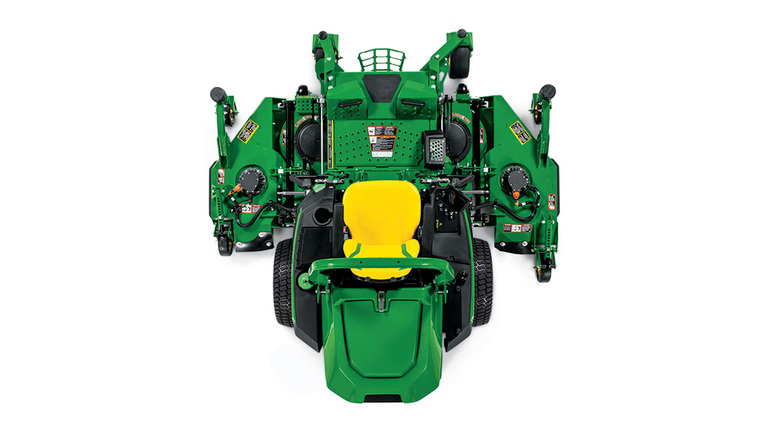 A top-down-facing green zero-turn mower with a yellow seat and green mowing deck on a white background.