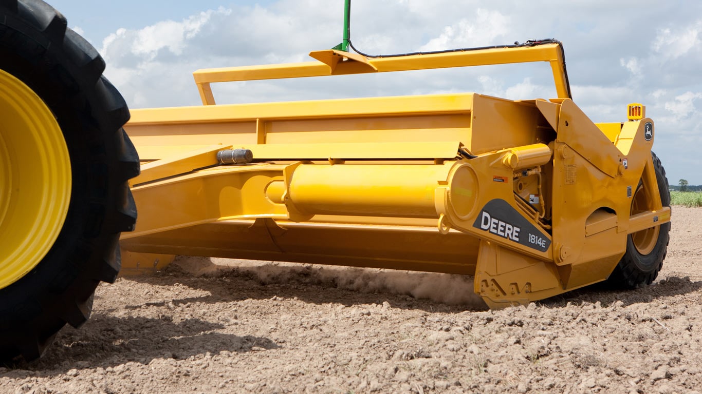 image of ejector scraper in dusty field