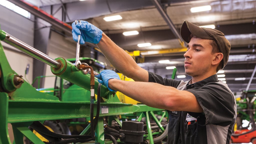 man in front of tractor