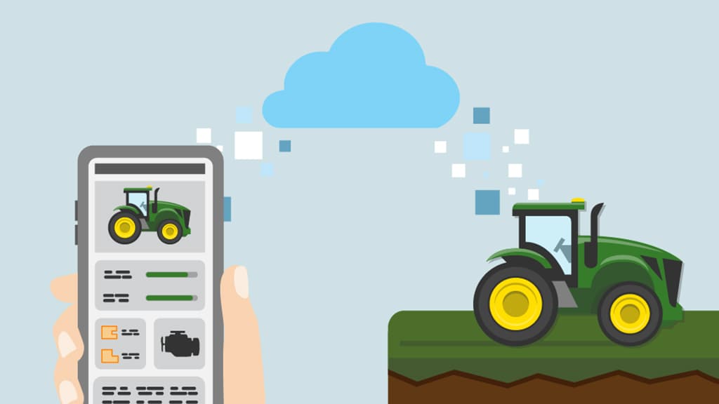 A hand holding a phone with a tractor on it