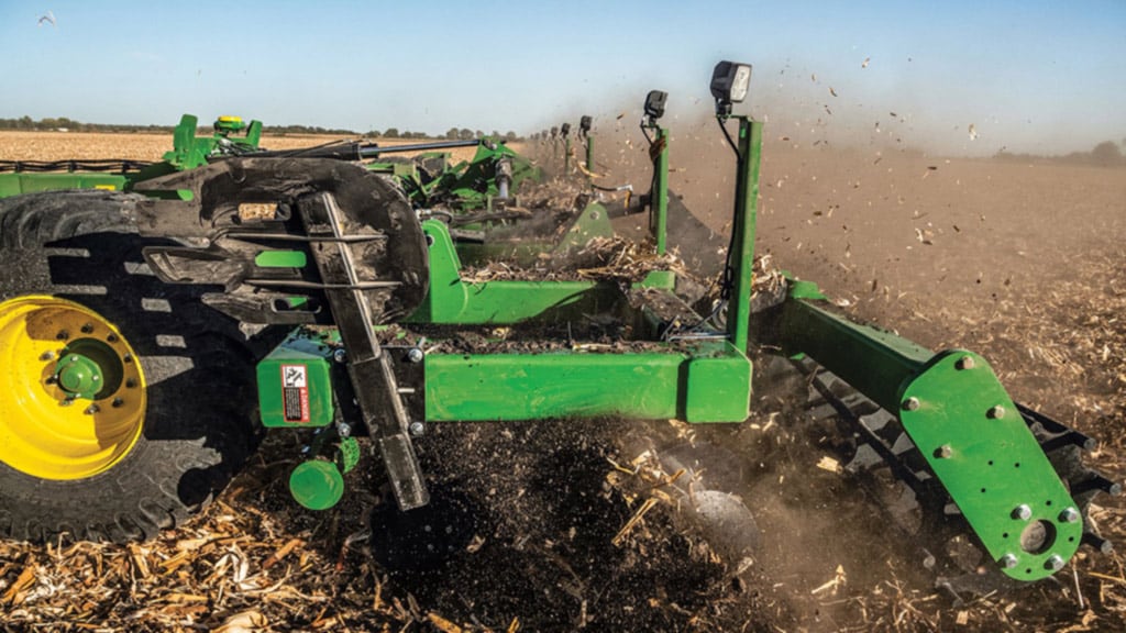 Close-up view of tilling a field.
