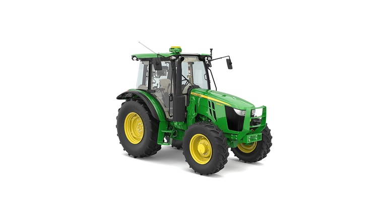 Green and yellow tractor with large tires and enclosed cab on white background.
