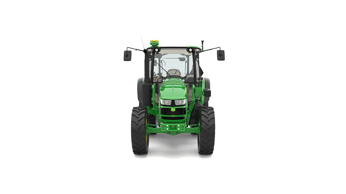 Front view of green tractor with large black tires, cab, mirrors, and lights.