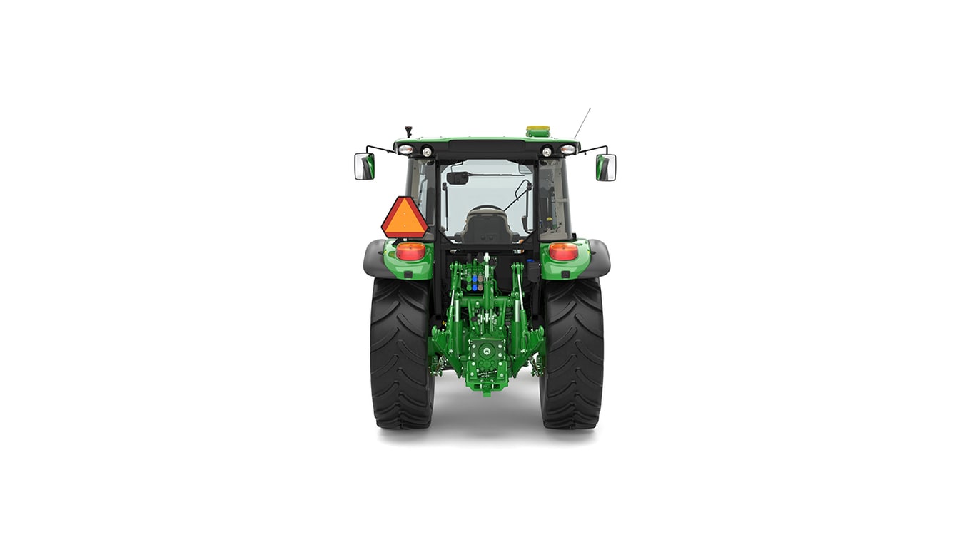 Rear view of green tractor with large black tires, orange warning sign, and side mirrors.